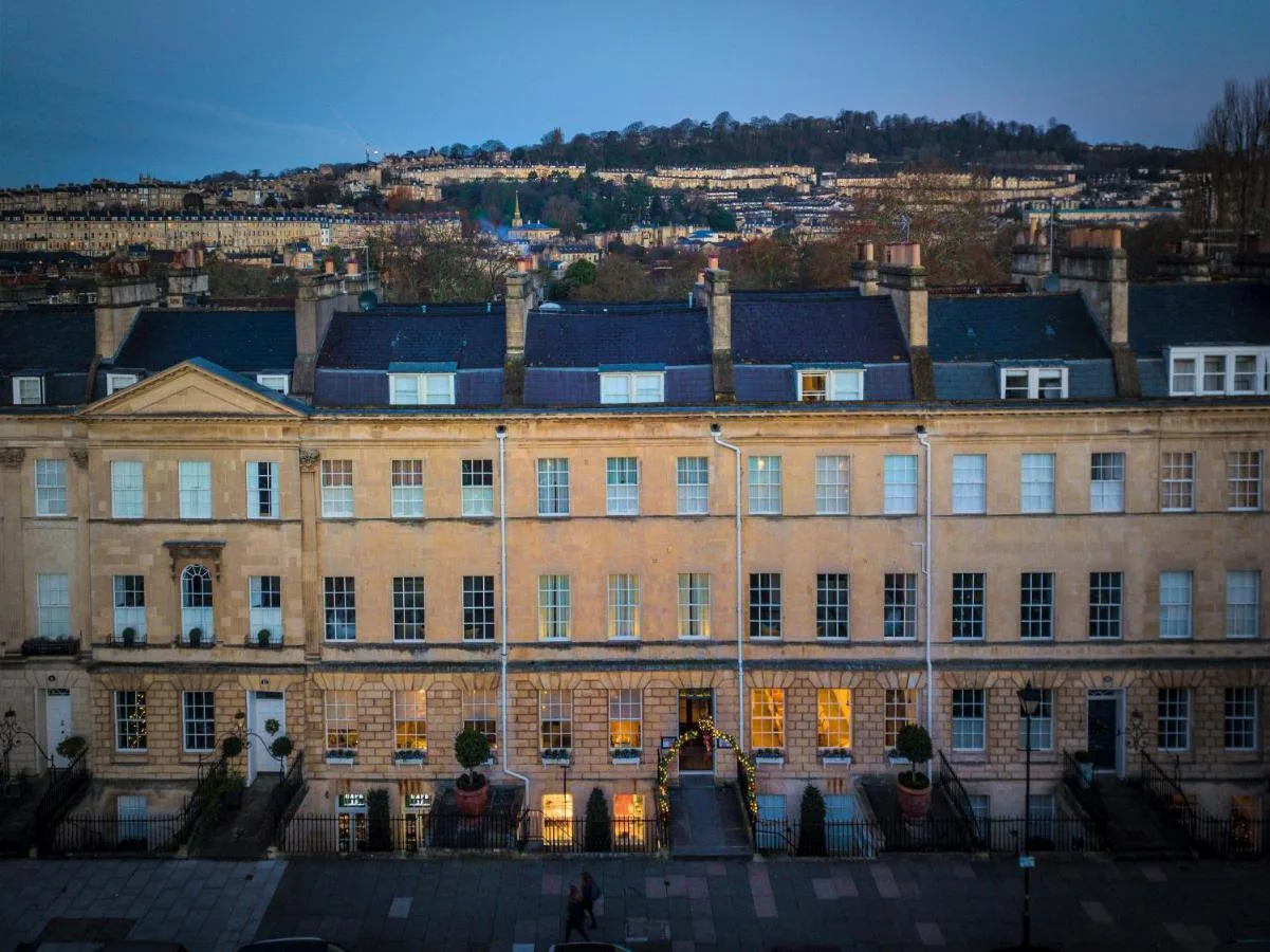 a large brick building with lights on at No 15 by GuestHouse, Bath in Bath