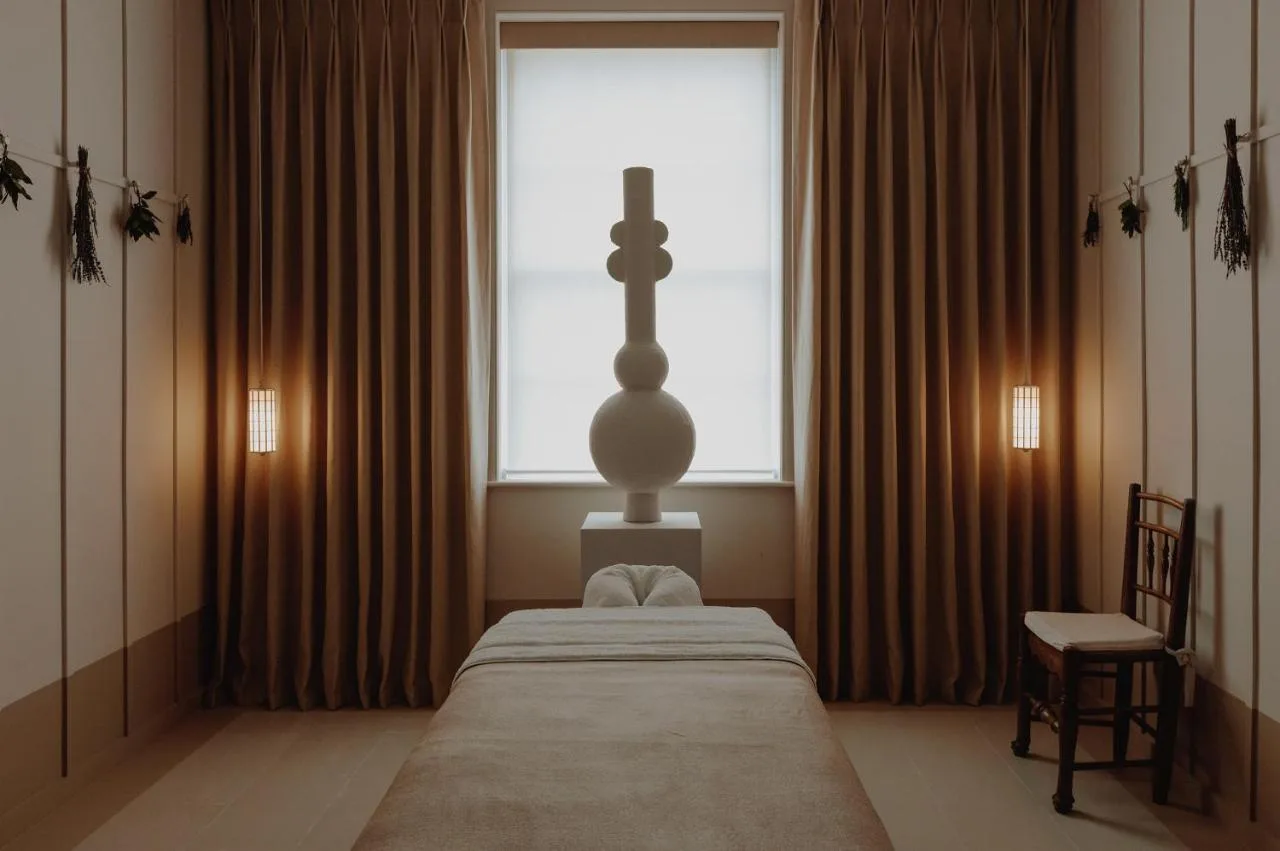 a bedroom with a bed with a cross on it at No 15 by GuestHouse, Bath in Bath